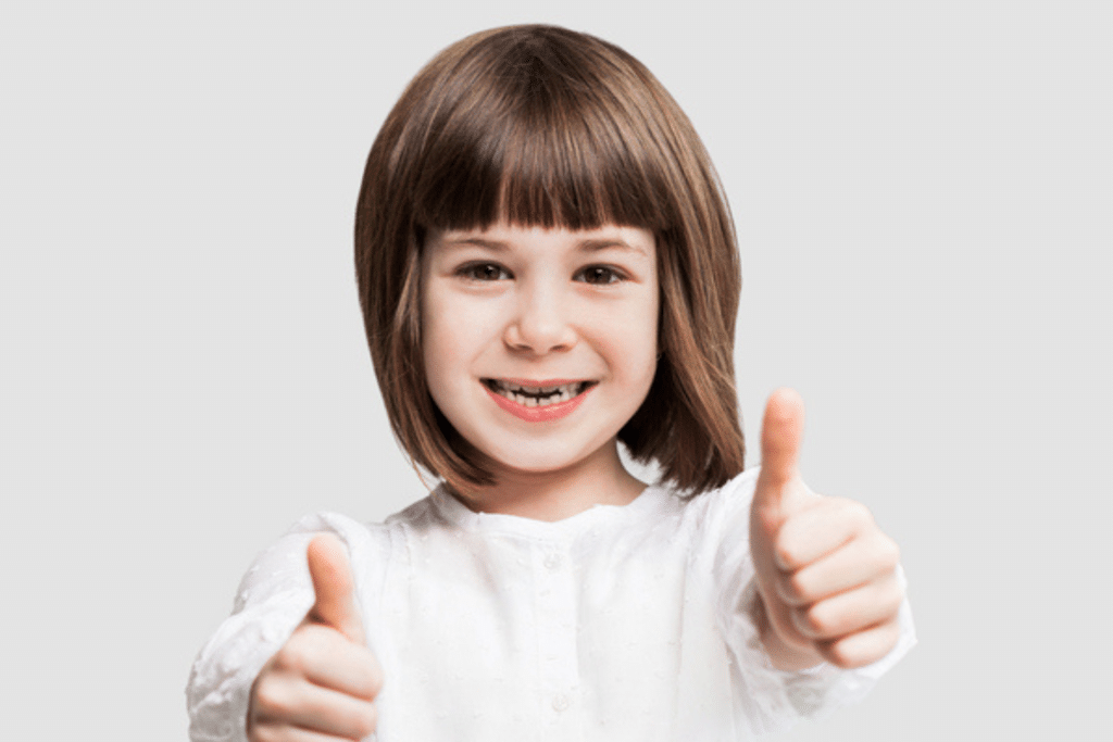 Young child with a missing baby tooth smiling for a pediatric dental blog in Humble TX