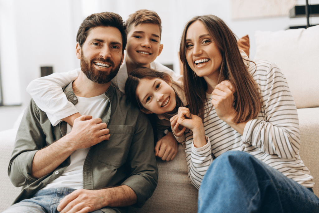 Smiling family considering sedation dentistry for a nervous child in Humble TX